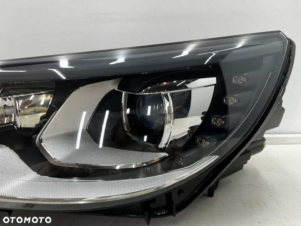 Lampa reflektor VW Tiguan 1 I 5n LIFT 10-16r. lewa przednia XENON EU skrętna doświetlanie zakrętów + - 6