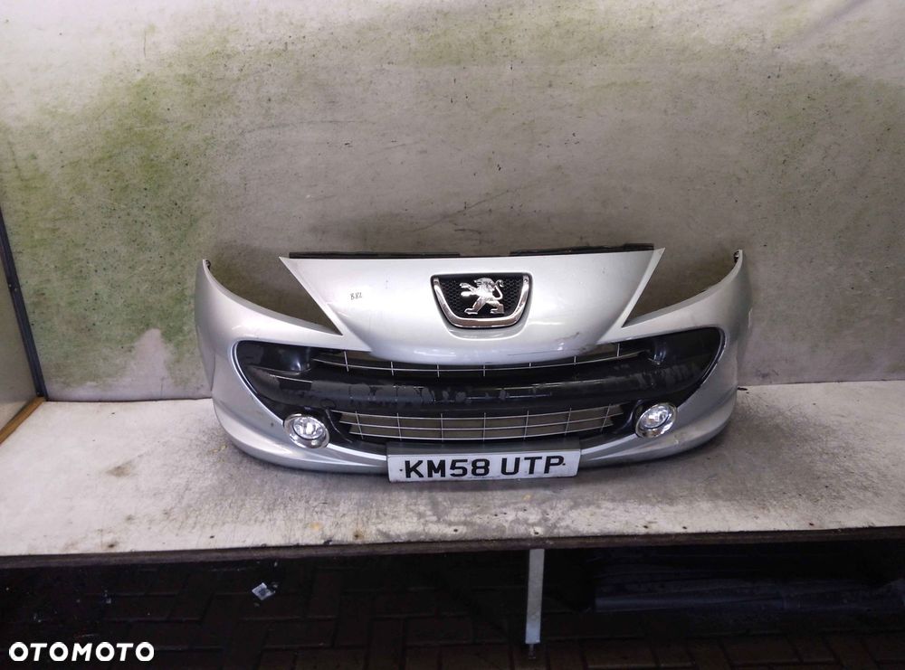 ^ ZDERZAK PRZÓD PRZEDNI PEUGEOT 207 URBAN MOVE EZRC SREBRNY HALOGENY - 1