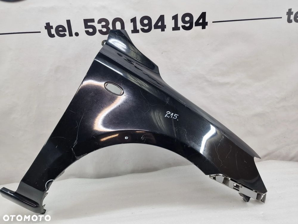 MAZDA 2 03-07 PRAWY BŁOTNIK PRZEDNI PRZÓD , NR AUKCJI BŁ215 - 1