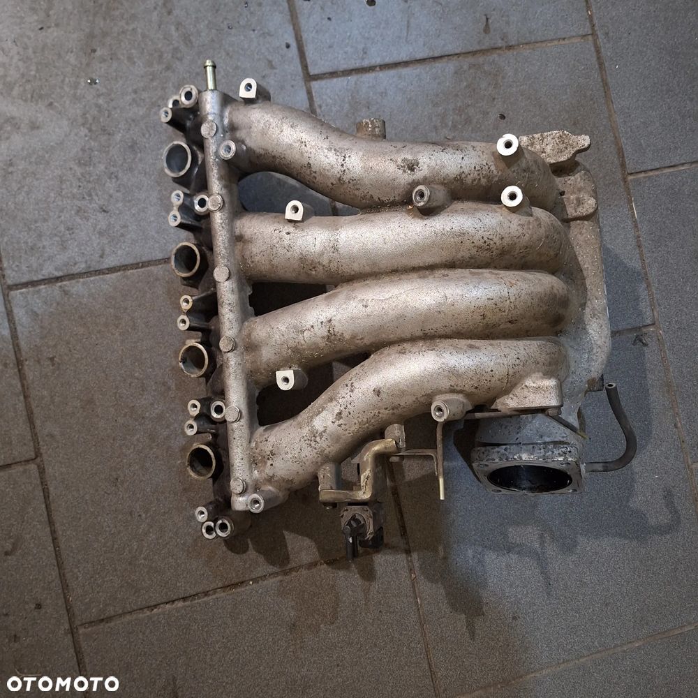 KOLEKTOR SSACY CARISMA 1.8 GDI - 1