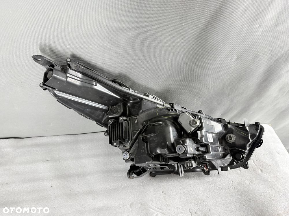 Reflektor lampa przednia lewa Toyota Highlander XU70 10100-8A06K - 9