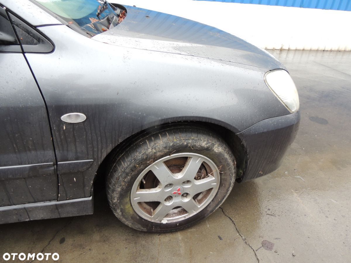 Błotnik prawy Mitsubishi Lancer 7 '06 - 1