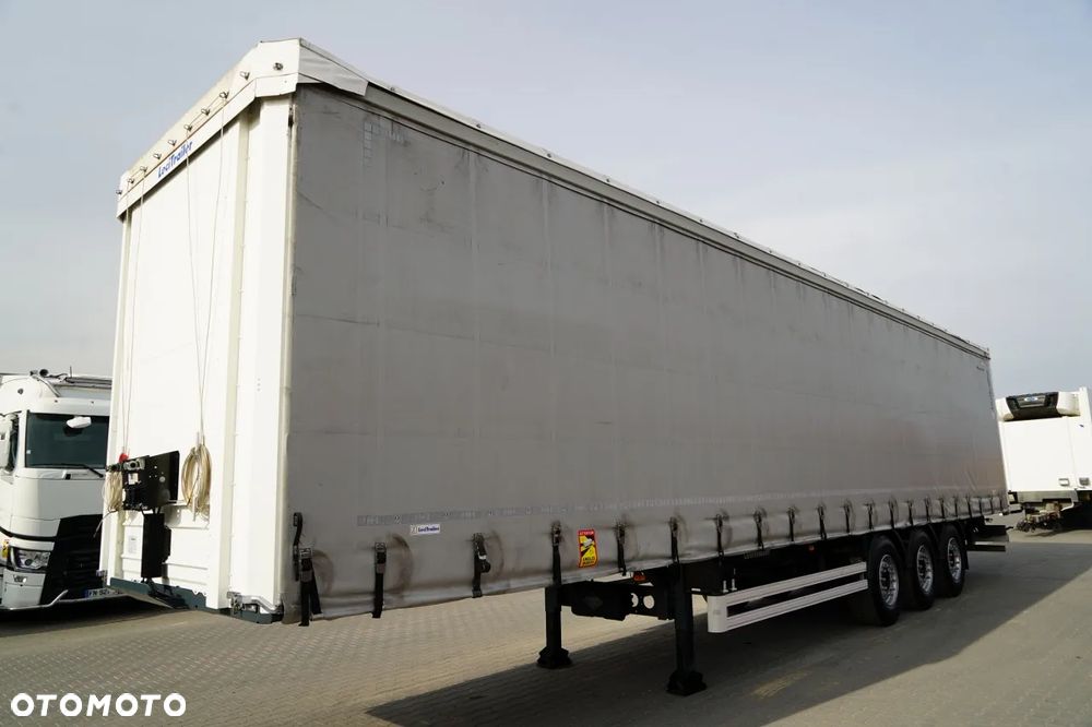 LeciTrailer FIRANKA / STANDARD / MOCNA PODŁOGA SZYNA DESKA / OŚ PODNOSZONA / OPONY 100%  / OSIE SAF - 4