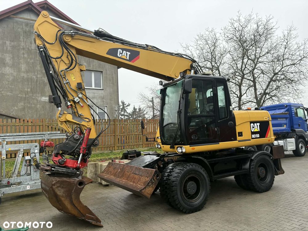 Caterpillar M 315D ROTOTILT SZCZYPCE PODPORY - 1
