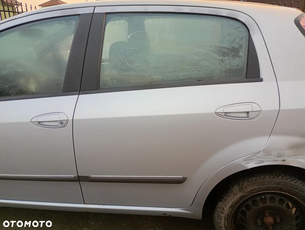 FIAT GRANDE PUNTO PUNTO EVO 348/B 5d drzwi lewe tylne lewy tył - 1