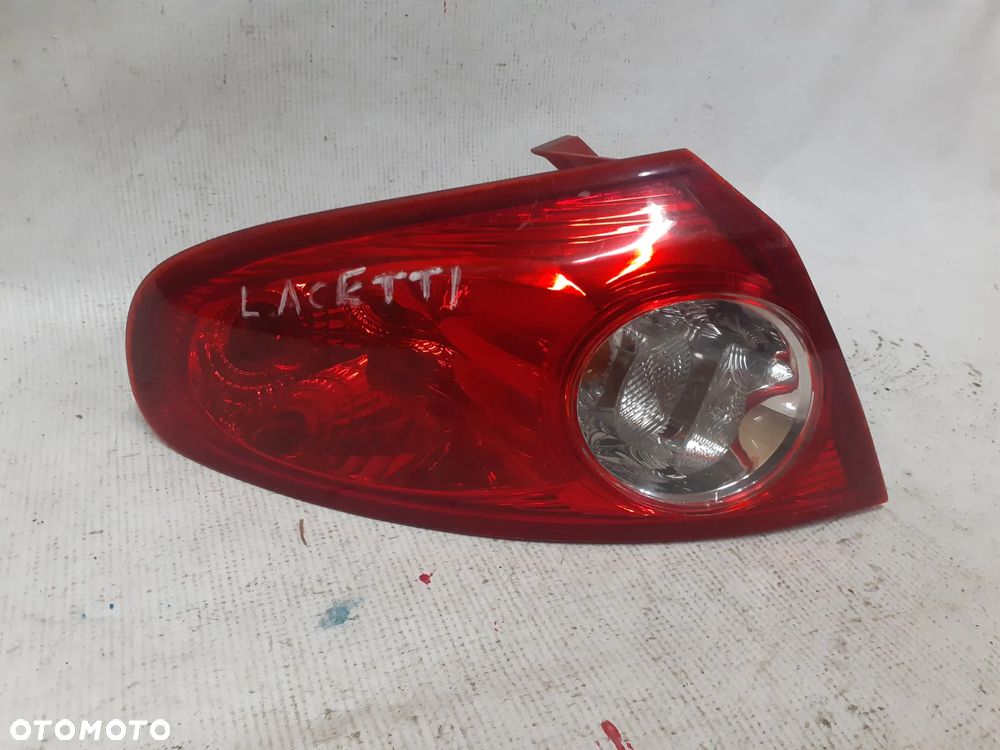 .  TYL TYLNA LAMPA LEWA CHEVROLET LACETTI - 1