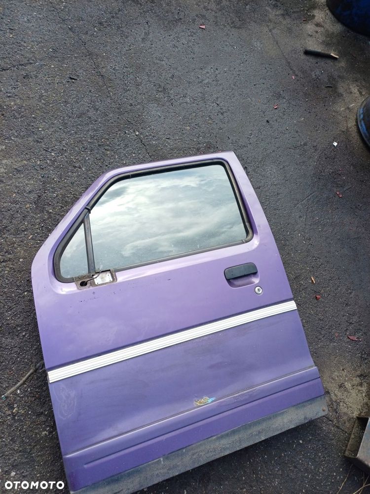 Szyba drzwi mała lewa przednia SUZUKI WAGON R 2000r 1.3benz - 1