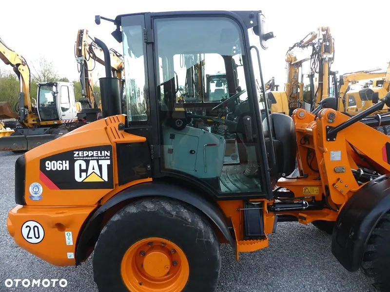 Caterpillar CAT 906H / Z Niemiec / 6424mtg / - 18