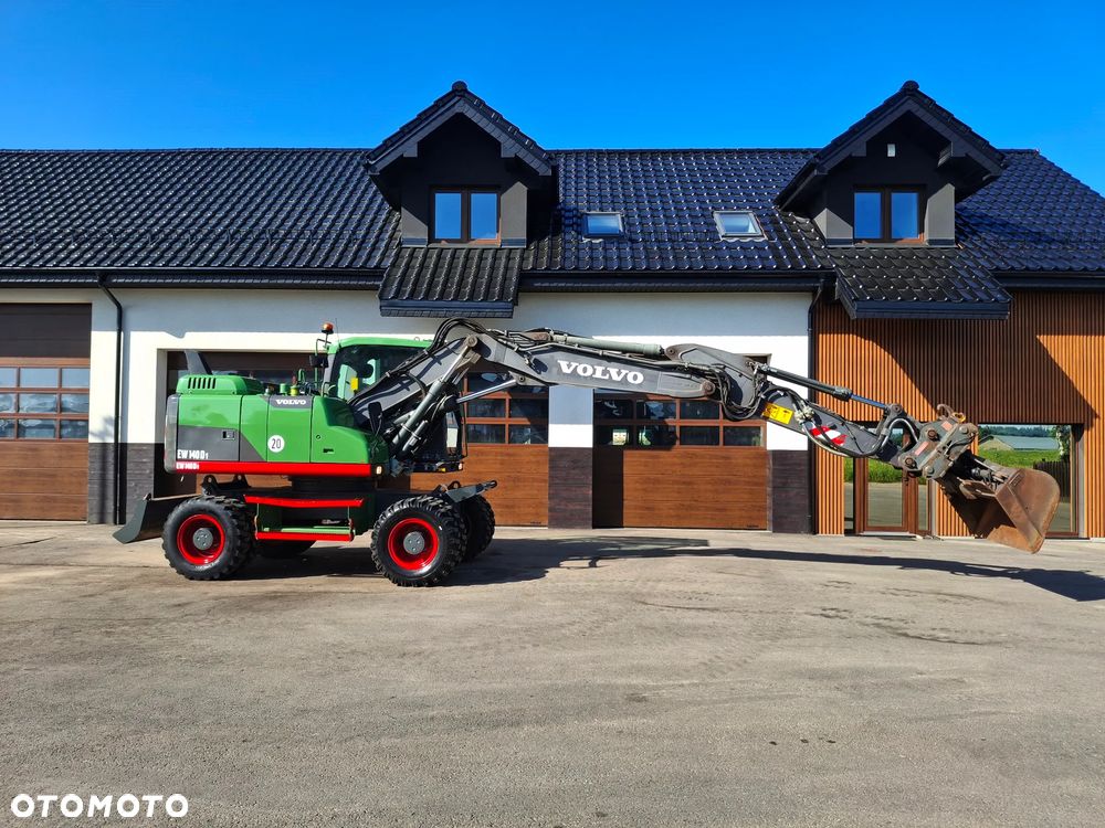 Volvo EW 140D Koparka Kołowa OilQuick Szybkozłącze Podwójne Koła 2015 Rok 2439 MTH Moc: 204 KM Dodatkowa Łyżka Pług Bardzo Dobry Stan Sprowadzona - 24