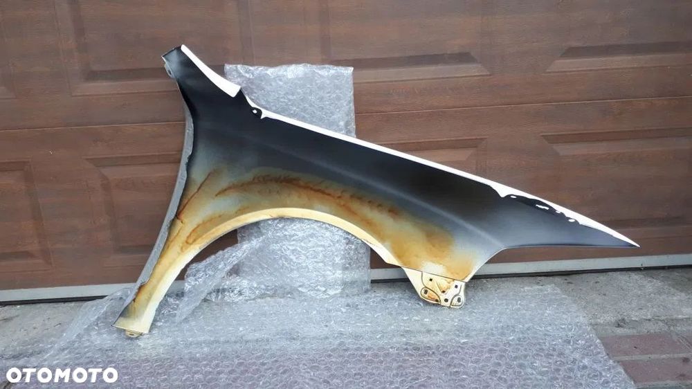 Skoda Octavia 2 II 2004-2008 Błotnik przód lewy 9102 - 2