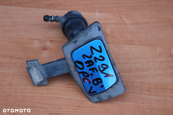 SPRYSKIWACZ LAMPY LEWY PRZÓD OPEL ZAFIRA B Z291 OPC ORYGINAŁ
