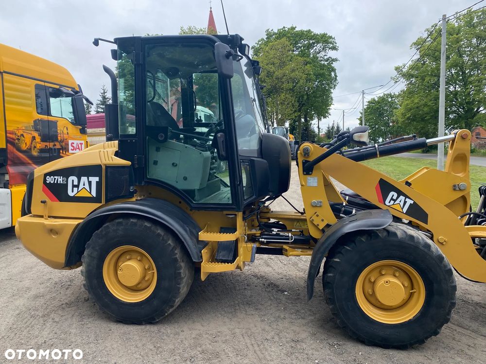 Caterpillar CAT 907H2, 2014 ROK, 4900 MTH, ŁYŻKA OTWIERANA + WIDŁY, z NIEMIEC, - 12
