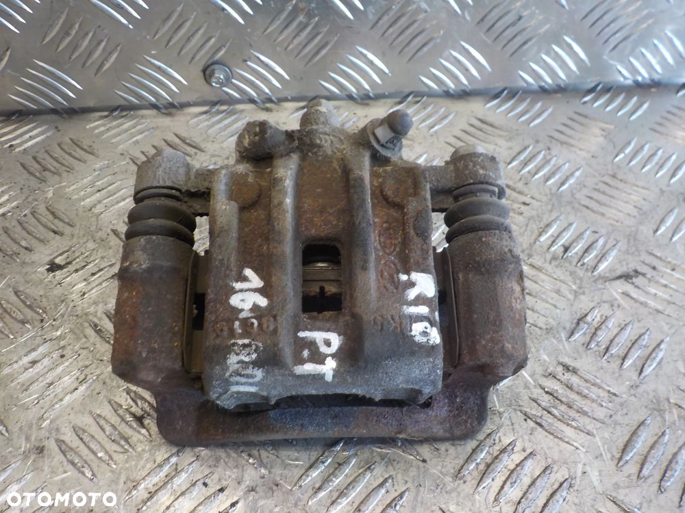 KIA RIO 3 III 05-10 JARZMO ZACISK PRAWY TYŁ