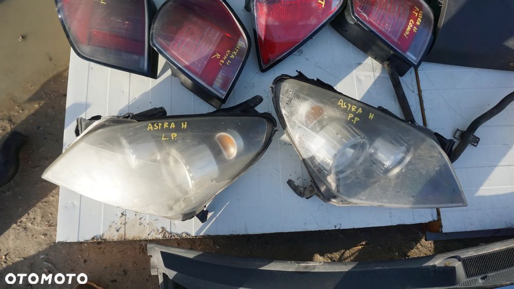 REFLEKTOR LAMPA ZBIORNIK PŁYNU SCHOWEK PASAŻERA ASTRA H - 9