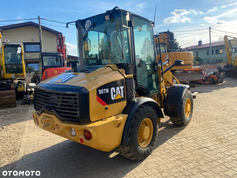 Caterpillar CAT 907M, 3400 MTH, 2015 ROK, ŁYŻKA OTWIERANA + WIDŁY, z NIEMIEC, - 4