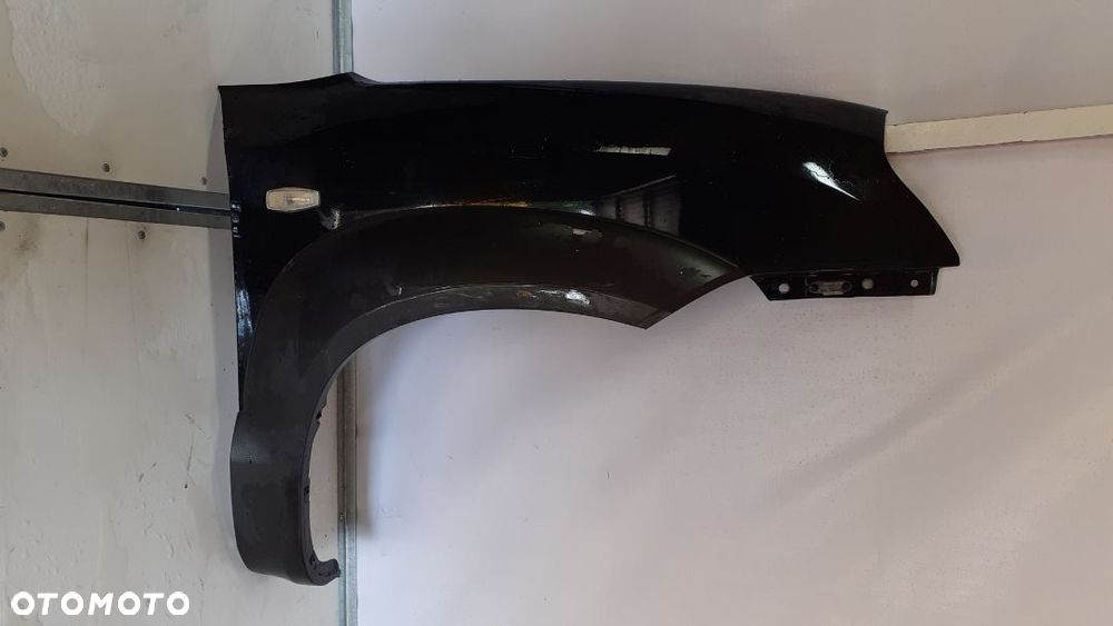 * BŁOTNIK PRZEDNI PRZÓD PRAWY HYUNDAI TUSCON I CZARNY EB - 1