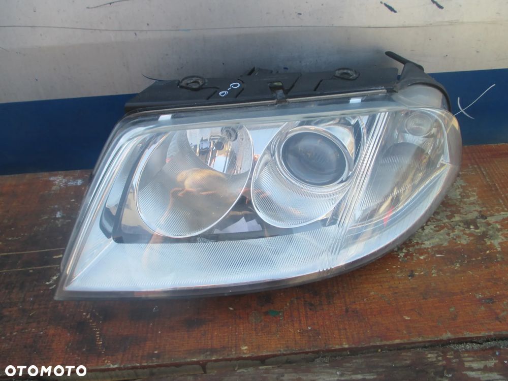lampa lewa VW Passat B5 lift Hella Europa - 1