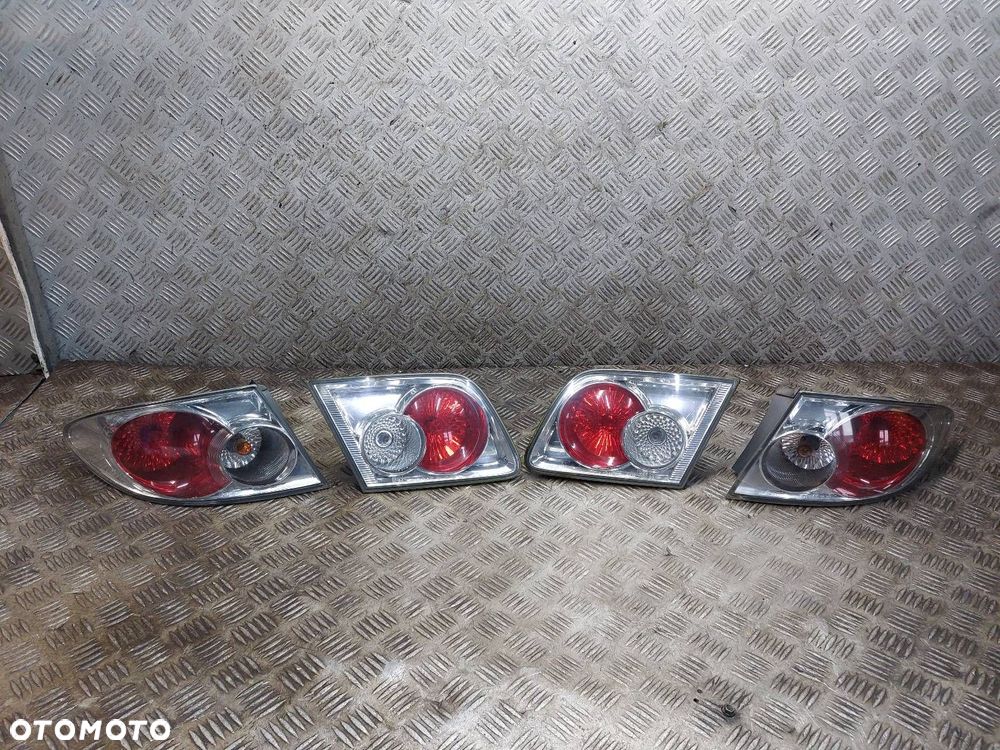 LAMPA LEWY TYŁ + PRAWY TYŁ KOMPLET W KLAPĘ W BŁOTNIK MAZDA 6 I HB 5D - 1