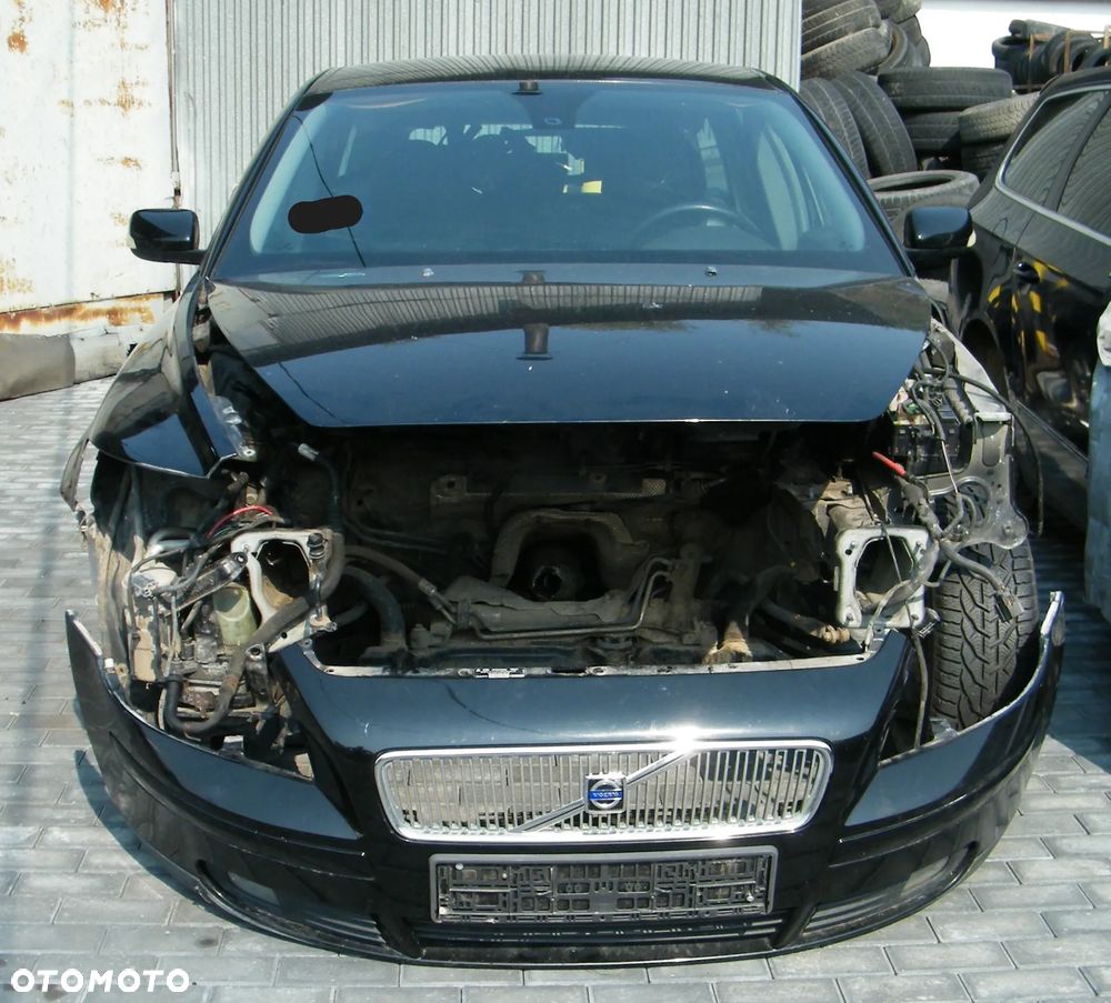 Volvo V50 (04-07r.) 2.0 TD 136KM. Silnik D4204T Skrzynia MMT6 lakier 019 – Black Stone. Cały na części. GWARANCJA !!!  Przód Tył Zestaw Komplet Drzwi Klapa Zderzak Błotnik Maska Grill Atrapa Szyba Pas Lampa Lusterko Boczki Fotel Kanapa Kokpit Deska Rozdzielcza Przełącznik Włącznik Sterownik Przewody Wiązka Instalacja Moduł Komputer Czujnik Listwa Pompa Alternator Wtryski Głowica Rozrusznik Kompresor Sprzęgło Dwumas Silnik Skrzynia ABS Klimatyzacji Paliwa Wspomagania Kolektor Turbina Przepustnica Zawór Chłodnica Koło Hak Belka Sanki Zawieszenie Mcpherson Półoś Amortyzator Wydech Tłumik Zacisk Most - 2