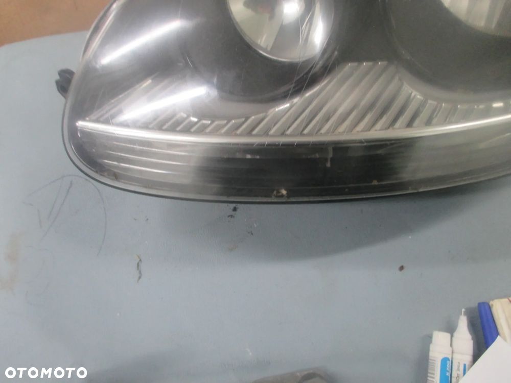 lampa lewa Golf V GT Hella Europa - 2