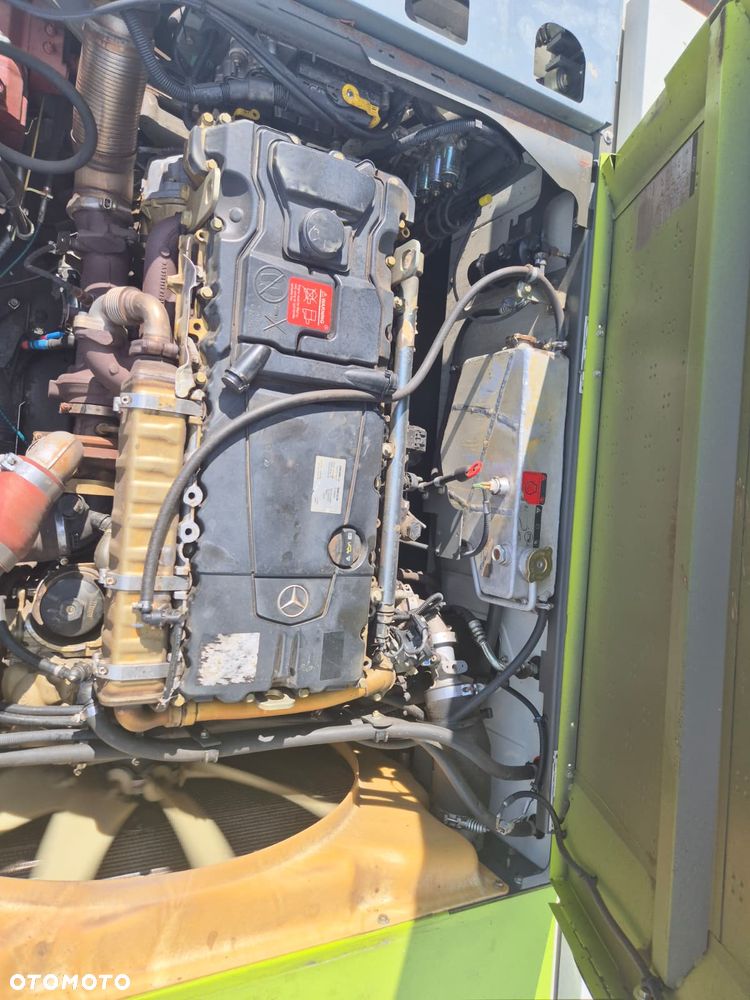 Claas Tucano 440 z hederem Vario 620 i przystawką do kukurydzy Olimac - 23