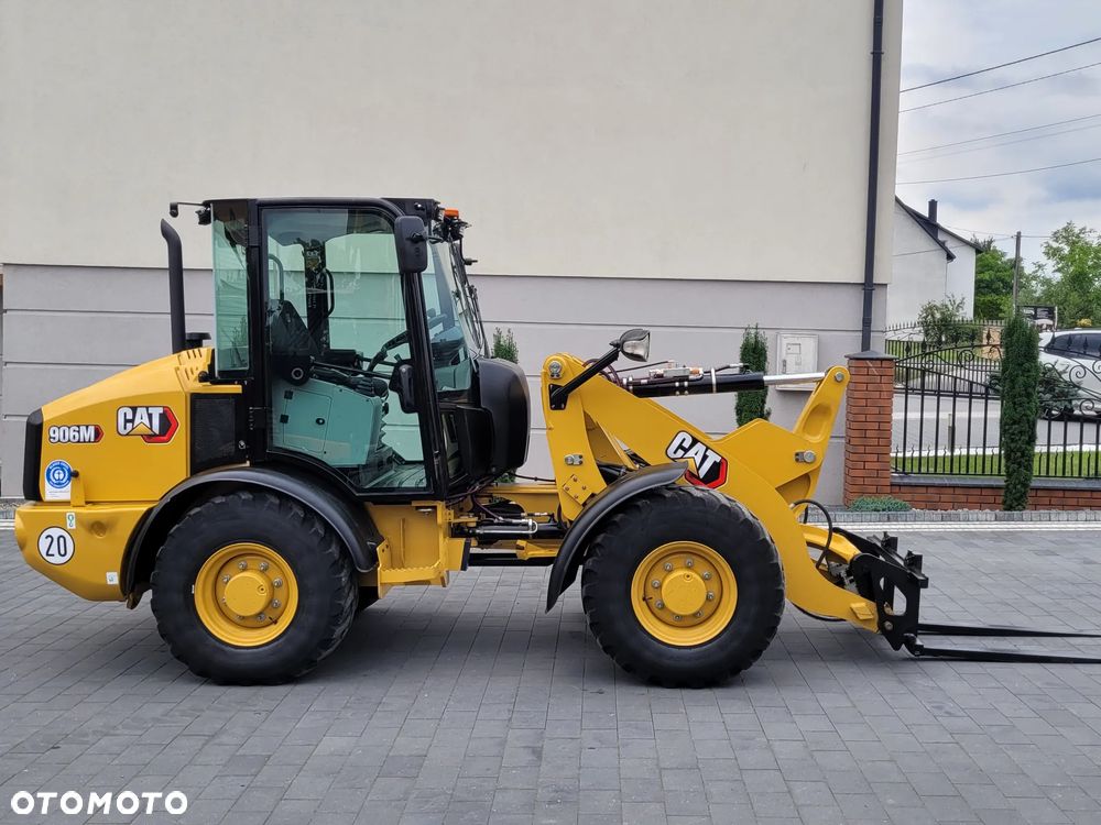 Caterpillar 906M / łyżka otwierana + widły / model 2022r. /