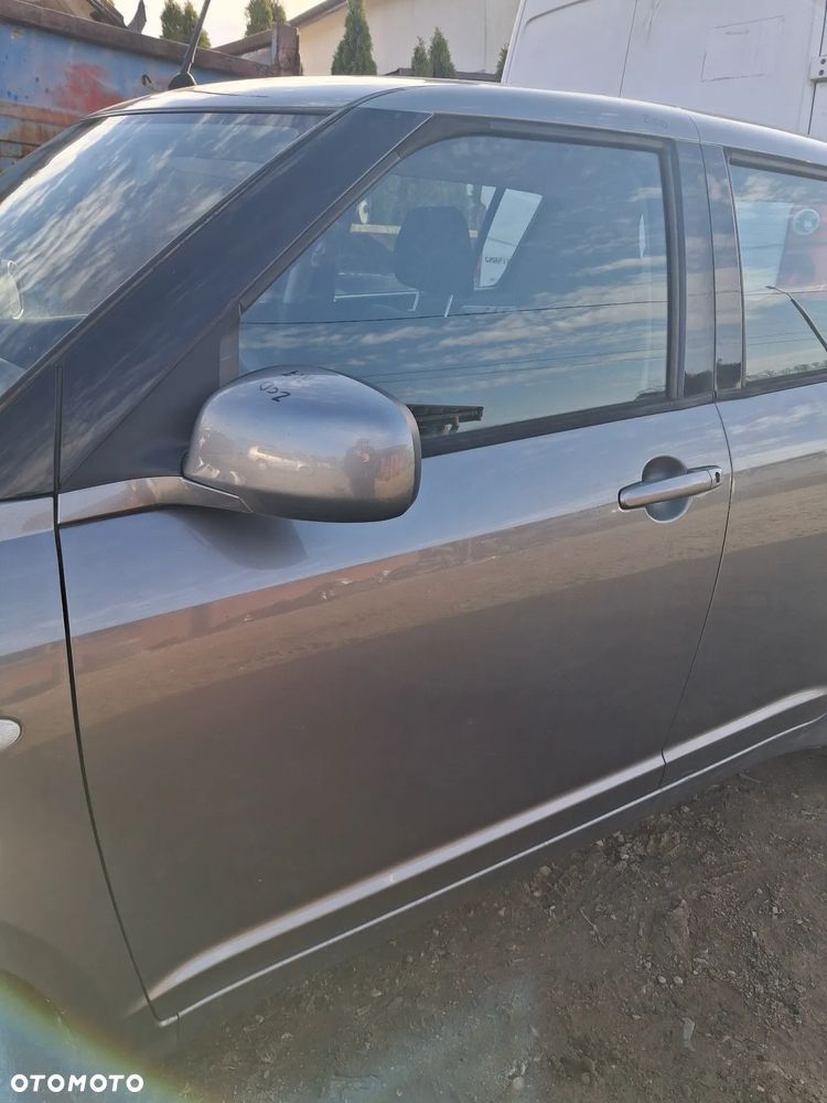 Suzuki Swift 05 drzwi lewy przod ZCD - 2