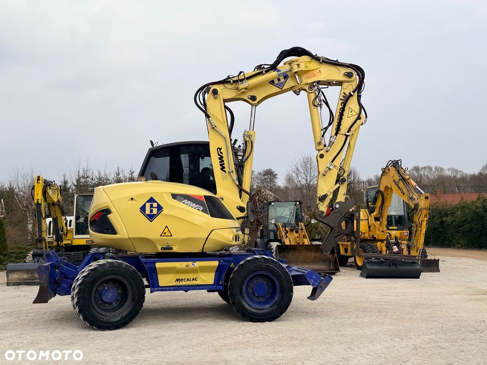 Mecalac Koparka 14 ton MECALAC 15 MWR koparko-ładowarka 3 łyżki widły 1 wł Centr.smarowanie Opony na BLIŹNIAKU 80%Camso ładowarka 714 12MTX 4x4 skrętne KLIMA kabina Premium silnik 146KM volvo EW140B DEUTZ szybka 35km/h - 38