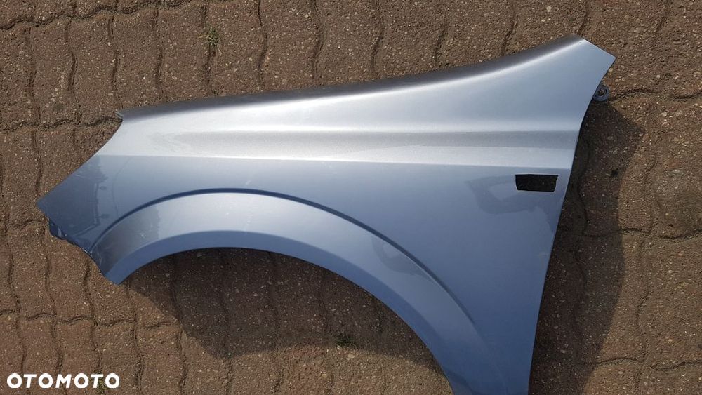 Błotnik przód  lewy  Opel Astra H III kod lakieru Z163 - 6