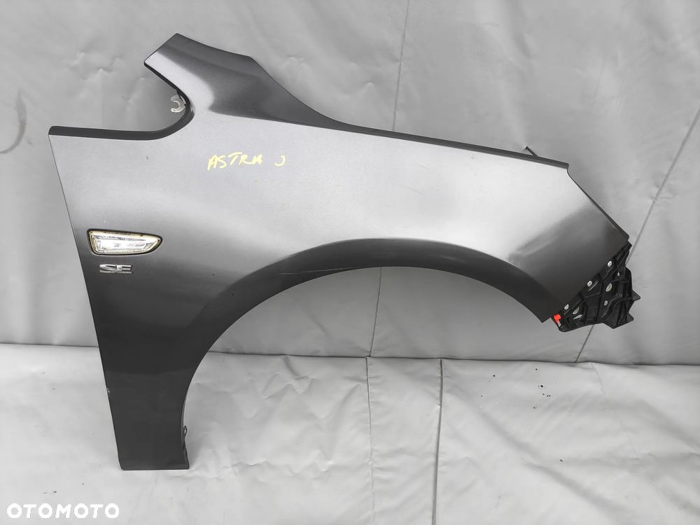 OPEL ASTRA J IV BŁOTNIK PRAWY PRZEDNI