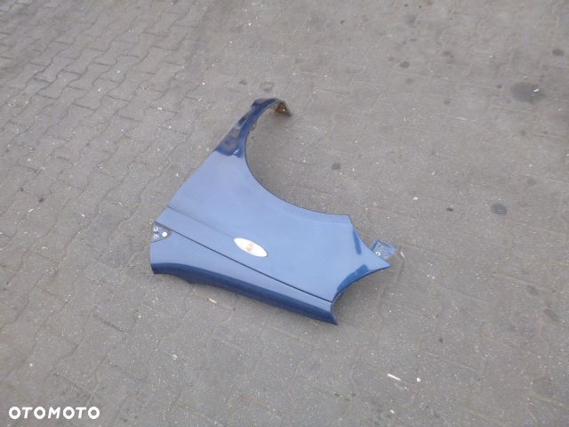 BŁOTNIK LEWY PRZÓD LEWY PRZEDNI TOYOTA YARIS I LIFT 03-05 - 12