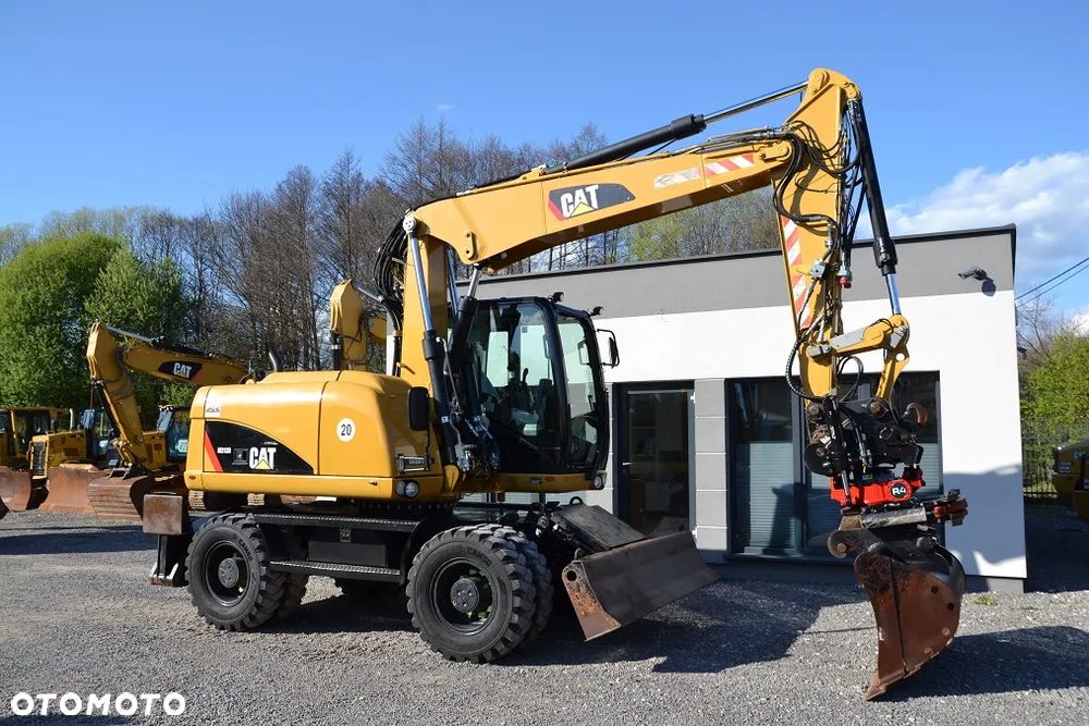 Caterpillar M 313 D, ROTOTILT - 13