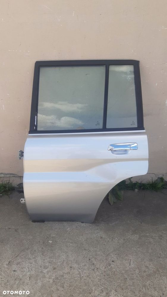 Drzwi lewy tyl MITSUBISHI PAJERO PININ 98-07r - 1