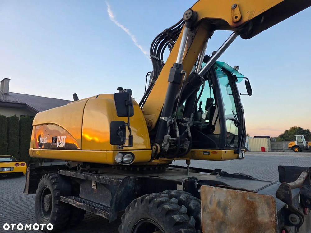 Caterpillar M318D, 2014 ROK, PODPORY + PŁUG - 12