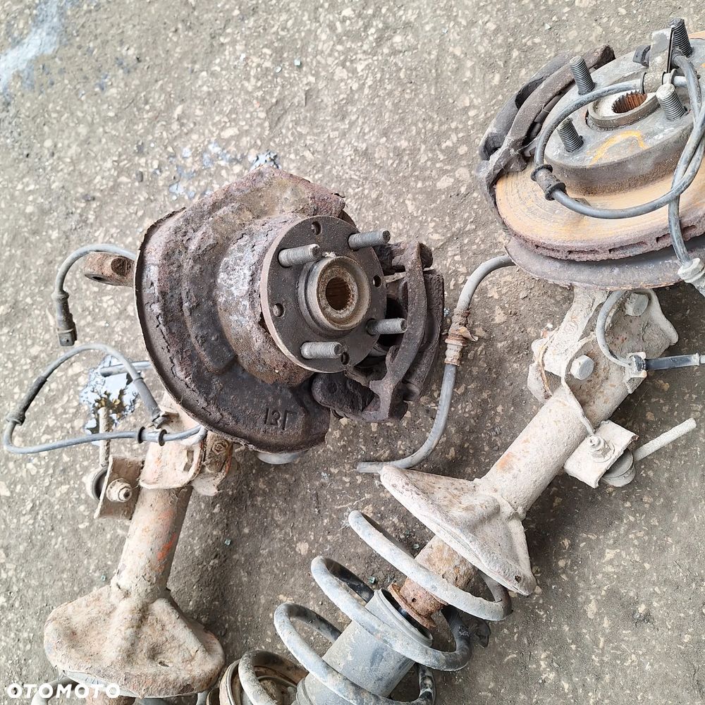 AMORTYZATOR MCPERSON ZWROTNICA PIASTA LEWA PRAWA PRAWY PRZOD MITSUBISHI CARISMA 1.6 16V 1.8 GDI VOLVO V40 S40 - 1