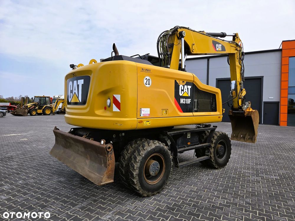 Caterpillar M 318F / z Niemiec /  9300 mth / - 4