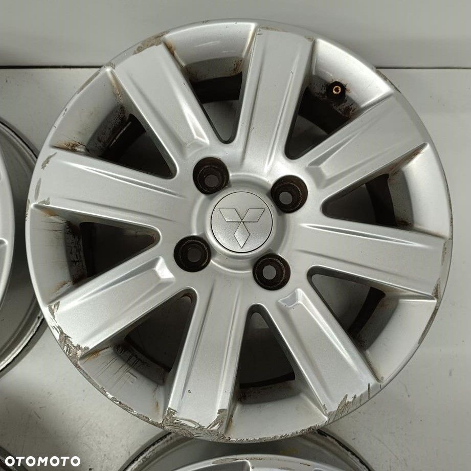 Alufelgi 4x114,3 15 Mitsubishi Colt 4250A756 4szt (F7882) - 4