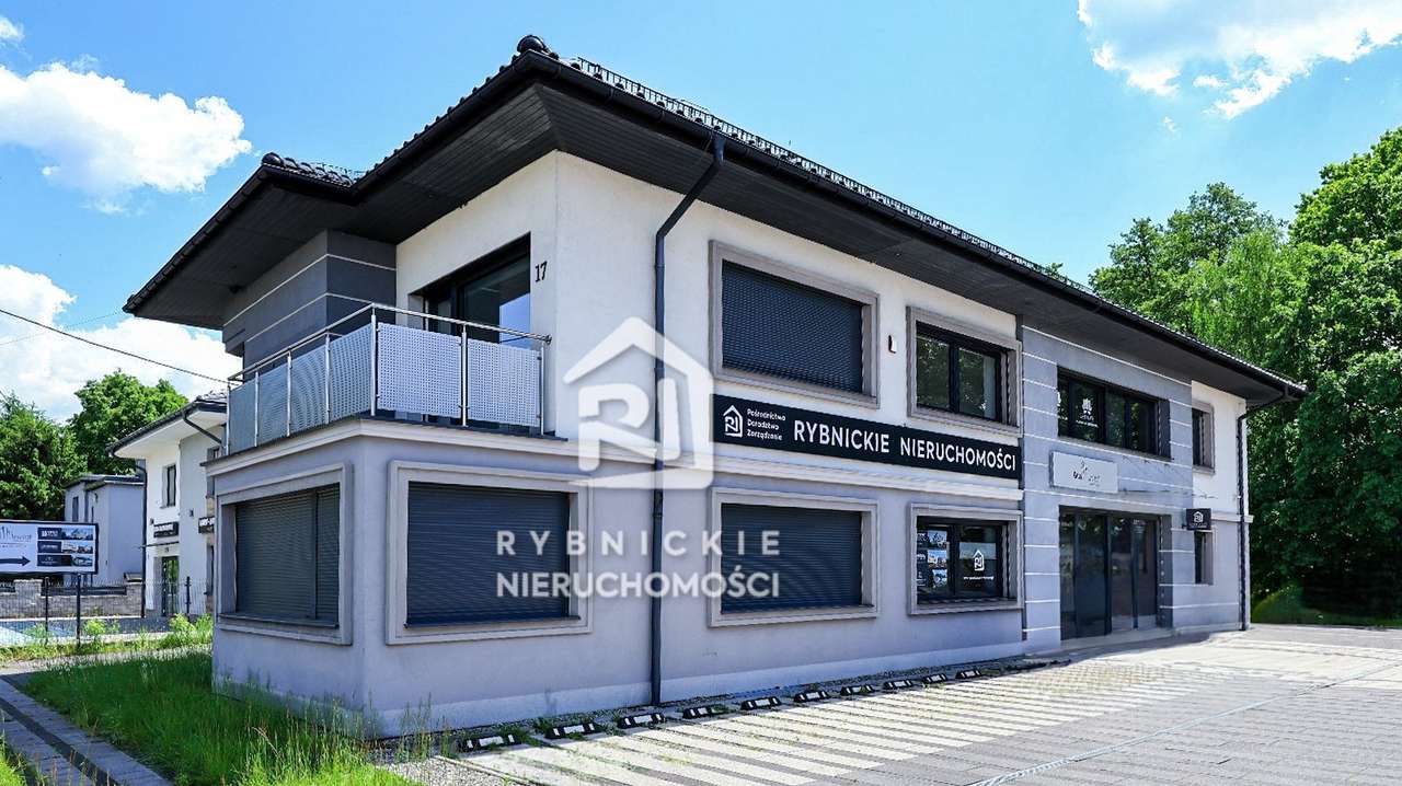 Logo Rybnickie Nieruchomości Sp. Z o.o.