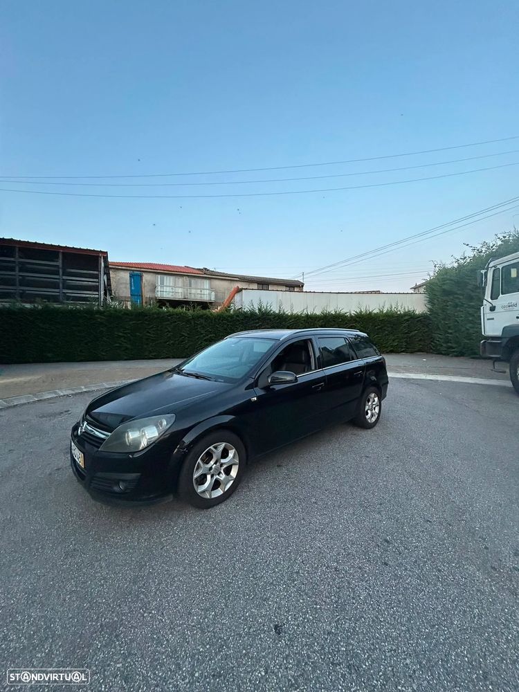 Opel Astra Caravan 1.9 CDTi Cosmo Plus - 1