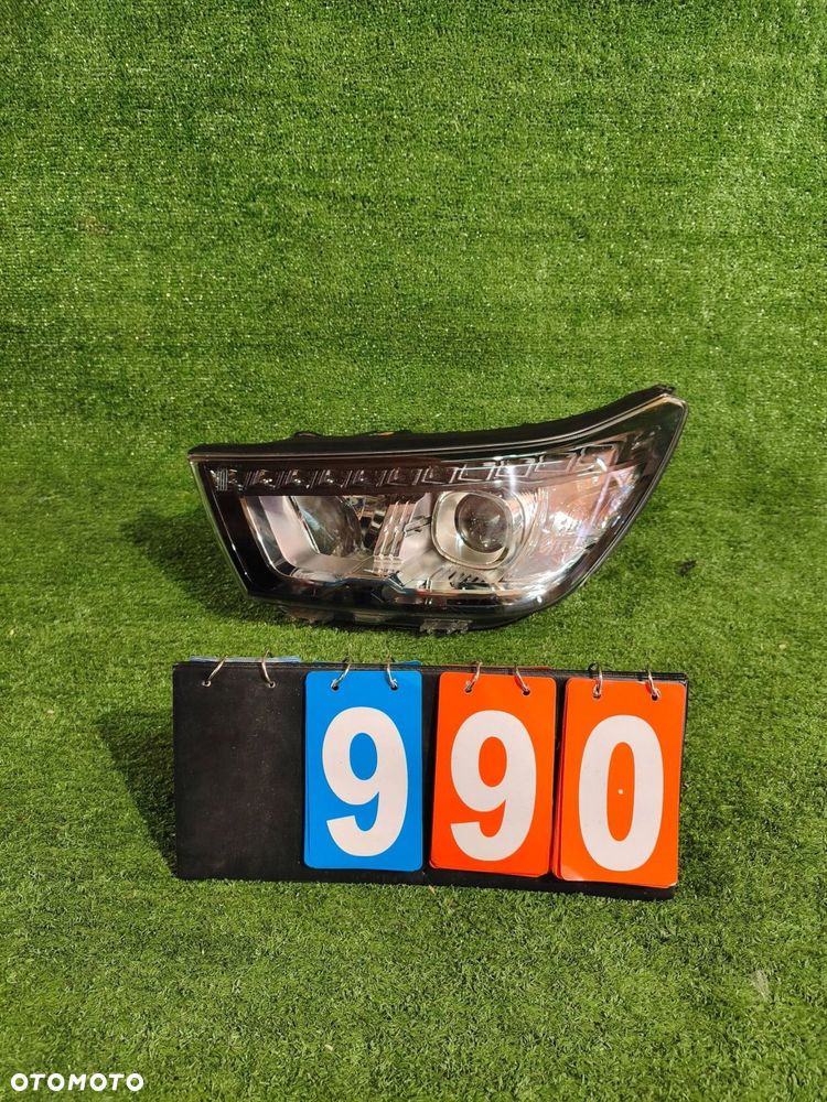REFLEKTOR LEWY PRZÓD SSANGYONG TIVOLI 15- XENON NR.990 - 1