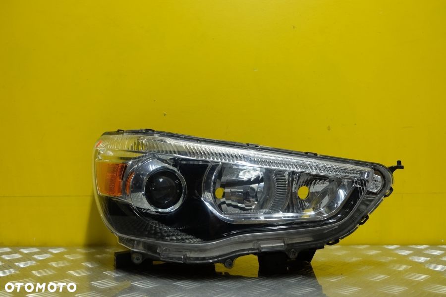 MITSUBISHI ASX RVR 10- REFLEKTOR LAMPA ZWYKŁA USA - 1