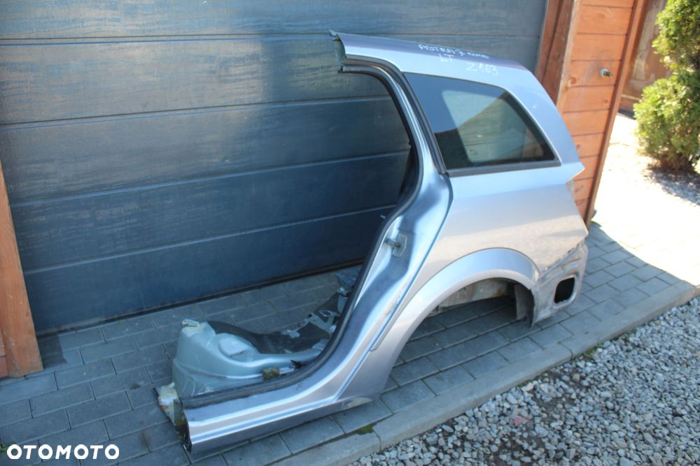 ĆWIARTKA BŁOTNIK LEWY TYLNY OPEL ASTRA H KOMBI Z163 - 2