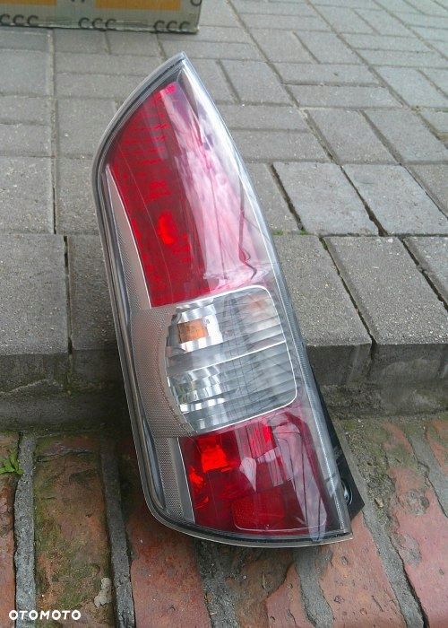 DAIHATSU SIRION II 2005-2014 LEWA TYLNA LAMPA ORYGINAŁ EUROPA - 1