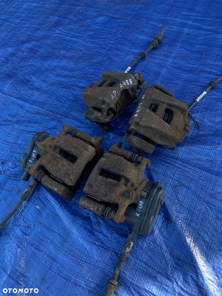 AUDI A4 B8 A5 8T Q5 2.0 TFSI ZACISK HAMULCOWY LEWY PRAWY TYŁ TYLNY KOMPLET  32335478 - 1