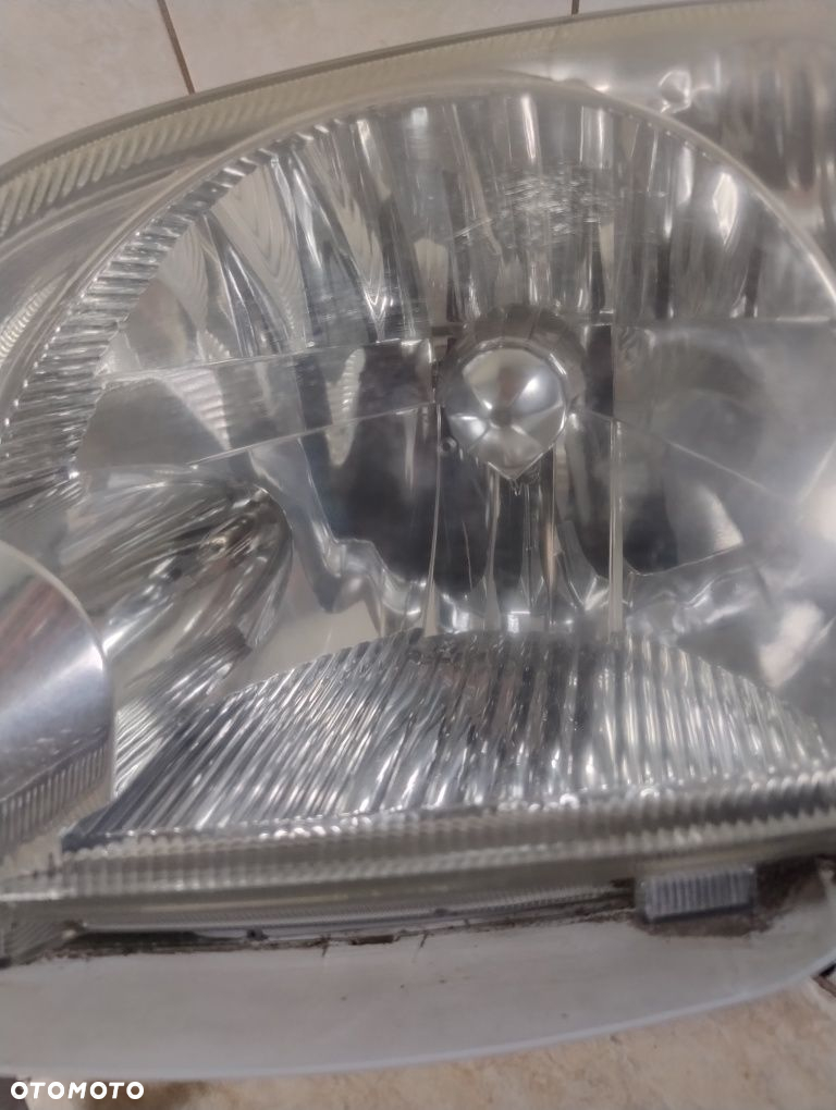 Daihatsu cuore 03-07 lampa lewa przód reflektor Europa wysyłka OLX - 3