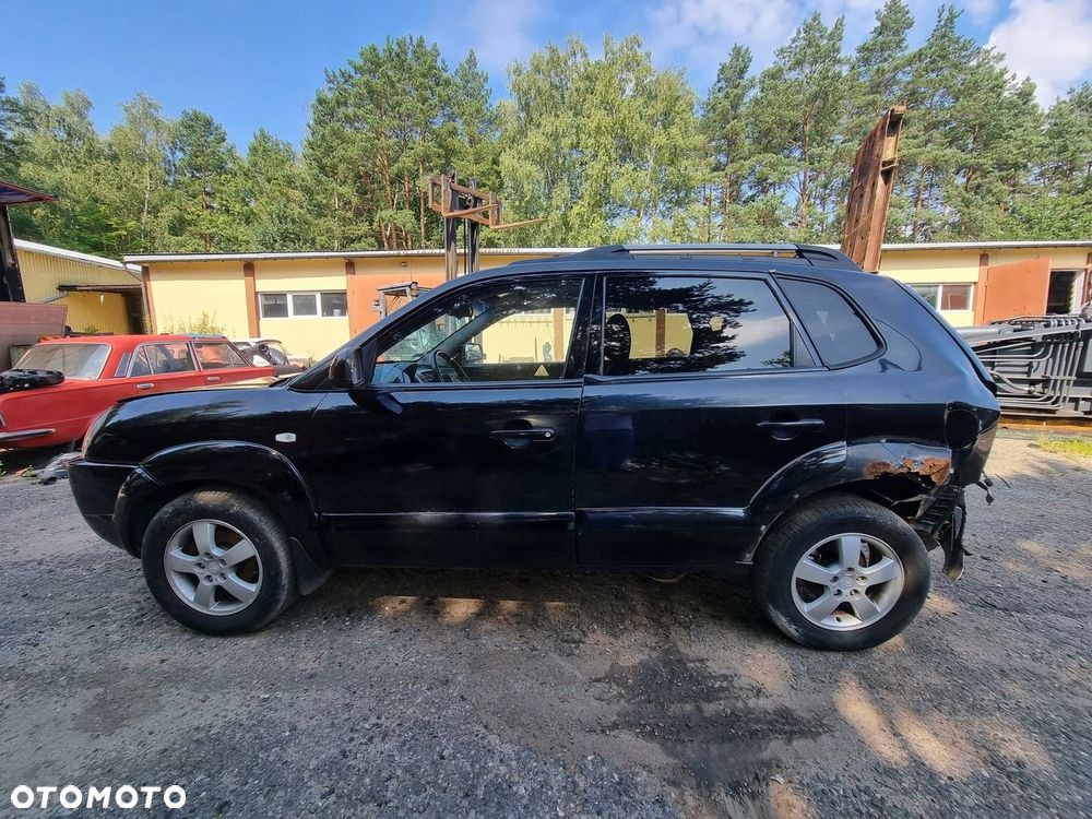 HYUNDAI TUCSON I 04-10 2007 r. EB BŁOTNIK LEWY PRZÓD LP Z LISTWĄ - 1
