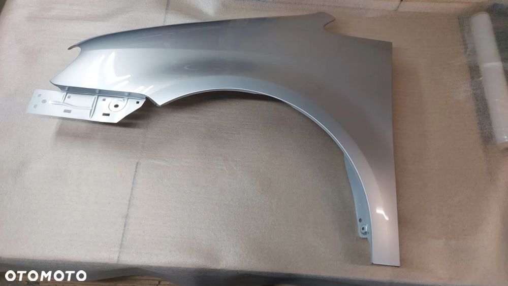 VW TOURAN I 03-06 rok BŁOTNIK LEWY LUB PRAWY LA7W CYNK.