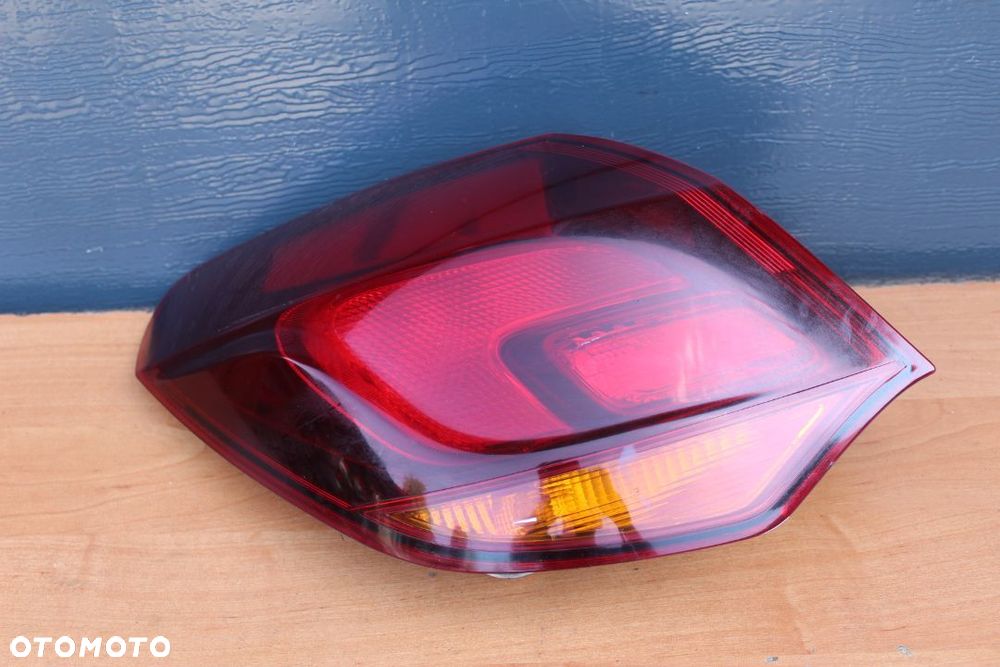 LAMPA LEWY TYŁ W BŁOTNIK OPEL ASTRA J HATCHBACK PRZED LIFTEM