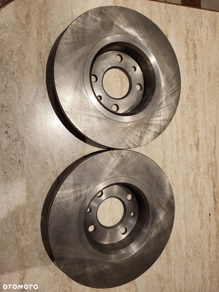 Tarcza hamulcowa  L/P  ALFA ROMEO 145, 146, 155; FIAT 500, 500 C, BRAVA, BRAVO I, MAREA, PANDA, PUNTO, SEICENTO / 600, TEMPRA, TIPO, UNO; LANCIA DEDRA, DELTA I 0.9-Electric 08.86- - 1