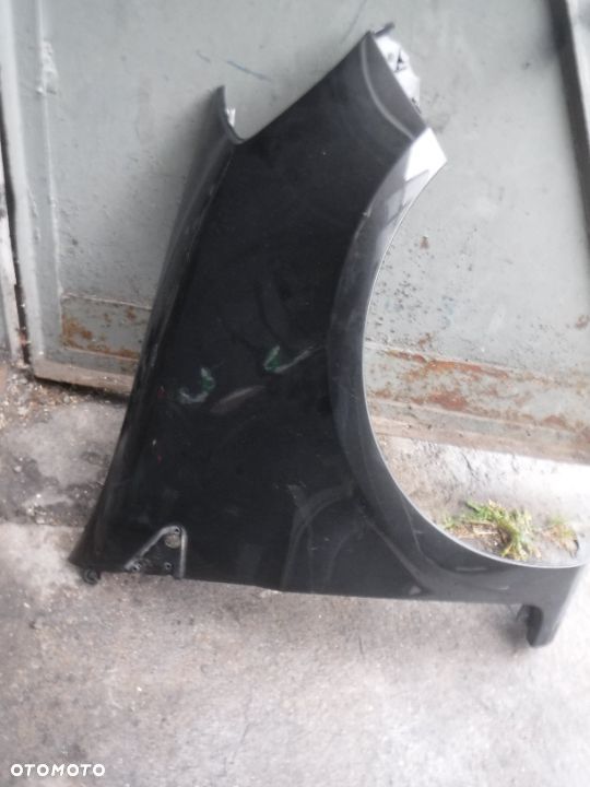 Renault Clio III blotnik prawy przod 185 - 1